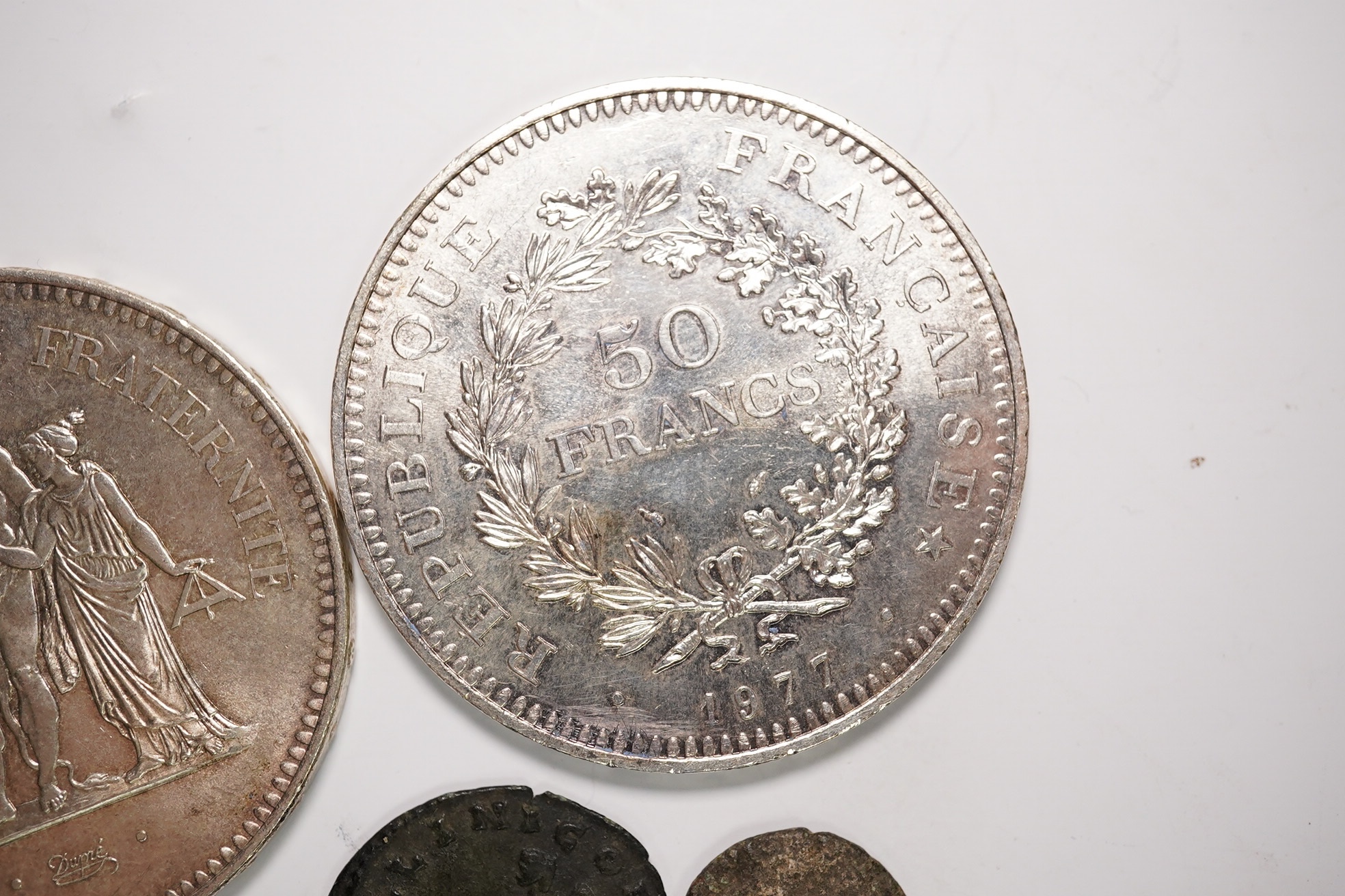Two fifty Franc silver coins and four Roman AE coins. Condition - as per images